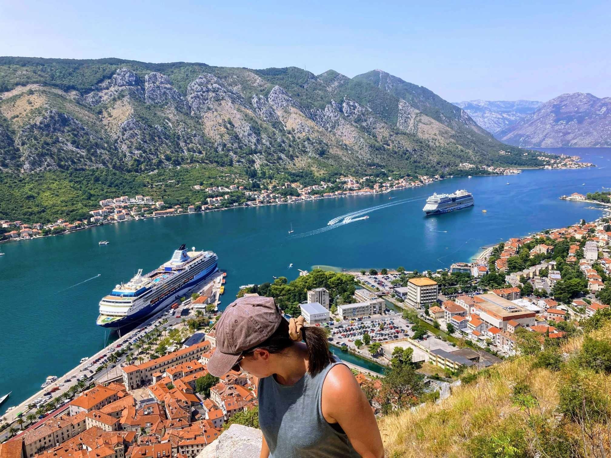 Person looking over Kotor Old Town from the top of Kotor Fortress